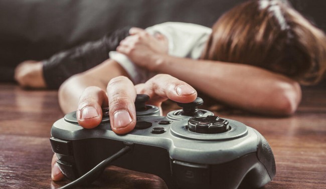 Boy holding game remote